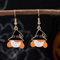 Halloween witch earrings with black hats and orange hair hanging on a wooden branch - Witch Hat Earrings