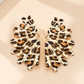 Macro detail of fan-shaped leopard print earrings with elegant gold metallic edging - Leopard Print Stud Earrings