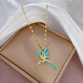 Elegant gold hummingbird pendant necklace with blue enamel and sparkling crystals - Hummingbird Style (J230)