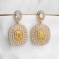 Detail of gold-plated tassel earrings with yellow rectangular zircon and sparkling stones - Gold Sugar Cube Dangle
