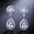 Detail of silver tassel earrings featuring teardrop zircon pendants and micro-pave setting - Silver Halo Teardrop Dangle