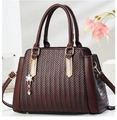Dark brown tote bag with twist texture, gold hardware, and floral charm pendant - Coffee