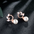 Detail of rose gold tassel earrings with zircon leaf design and round white pearls - Rose Gold Leaf Pearl Studs