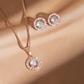 Elegant rose gold jewelry set with round cubic zirconia halo necklace and stud earrings - Rose Gold Set