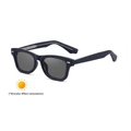 Square black frame photochromic sunglasses with metal rivet accents and dark grey lenses - Sand Black to Grey
