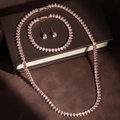 Roségouden hiphop sieradenset met peervormige strassteentjes inclusief ketting en armband - Rozegoud (ZPS207B)