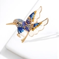 Exquisite hummingbird brooch with blue crystals and enamel on golden metal base - Blue Bird