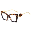 Occhiali cat-eye tartarugati con stanghette dorate e dettagli a cuore traforati - Stampa Leopardata/Tartarugato