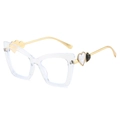 Transparent cat-eye glasses frame with golden metal arms and heart detail - Clear