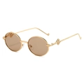 Retro oval sunglasses with golden metal frames and detailed snake carving on temples - Gold Frame Champagne Lens