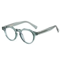 Vintage round eyeglasses in transparent dark green with visible metal core and rivets - Transparent Green Frame