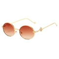 Oval gold metal sunglasses with serpent temple carvings and red-orange gradient lenses - Gold Frame Gradient Tea Lens
