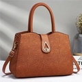 Brown leather handbag with lace texture, gold hardware, and top handle for women - Khaki/Earth Yellow