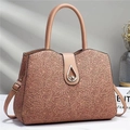 Detail of a soft pink PU leather tote featuring floral lace texture and water-drop metal clasp - Apricot
