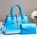 Detail of blue gradient crocodile pattern tote bag and matching long wallet set - Blue