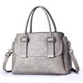 Minimalist grey faux leather tote bag with vintage texture and silver buckle detailing - Light Gray