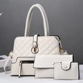 Detailed close-up of 3-piece quilted white PU leather handbag set with gold hardware - Milky White