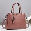 Dusty pink leather tote bag with V-shaped metal hardware and adjustable shoulder strap - Dusky Pink