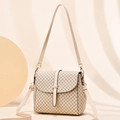 Elegant beige crossbody bag with black geometric print and gold metal buckle - Khaki