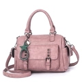 Dusty rose leather handbag for women featuring metallic rivets and a star charm - Pink