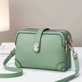 Green litchi grain leather crossbody bag with three zipper compartments and gold clasp - Green