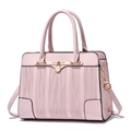Pink faux leather handbag with vertical wave texture and gold lock charm detail - Pink
