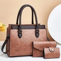 Dettaglio del set 3 pezzi di borse vintage in pelle marrone con portafoglio e pochette abbinati - Rosa Antico