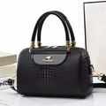 Elegant black lizard pattern bucket bag with golden kangaroo logo and adjustable strap - Black
