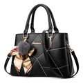 Black quilted handbag with white diamond stitching and floral scarf handle wrap - Black