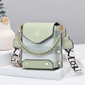 Mini light green crossbody bag with textured pattern and wide white canvas shoulder strap - Green