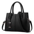 Grand sac à main en cuir grainé noir avec doubles poignées et détails dorés sur fond blanc - Noir