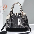 Elegant black and white snake-patterned shell handbag with silk scarf handle detail - Black