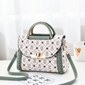 Fashionable green contrast patchwork handbag with logo prints and metallic handle - Printed Green