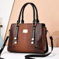 Brown lizard embossed leather boston bag with black patent handles and gold hardware - Khaki/Earth Yellow