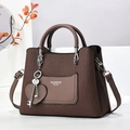 Dark brown textured tote bag with wave pattern and fashion queen lettering on white stand - Coffee