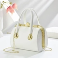 Detail of white evening bucket bag with rhinestone metal frame and pearl clasp - 23x14x17cm / White