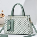 Detail of mint green tote bag set with geometric print and matching envelope pouch - Green