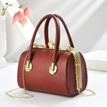 Dark red lychee pattern barrel bag with pearl clasp and golden chain strap - 23x14x17cm / Red