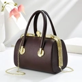 Elegant dark brown lychee textured bucket bag with gold frame and pearl clasp detail - 23x14x17cm / Coffee