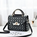 Black leather crossbody bag with teddy bear prints and gold circular metal handle - Print Black