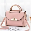 Pink lychee leather handbag with gold handle and woven side detail for women - Pink