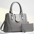 Grey crocodile embossed two-piece tote bag set with gold hardware on white marble - Gray