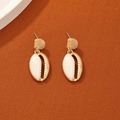 Bohemian style gold-rimmed shell stud earrings with white enamel on orange fabric - White Shell Earrings