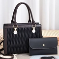 Quilted embroidery handbag set with gold circular handle and matching envelope clutch - Black