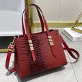Deep red lizard-pattern tote bag with gold hardware accents and top handles - Red