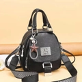 Black soft leather handbag with rhinestone S logo and geometric stripe shoulder strap - Black