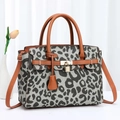 Women's 2024 cow print fashion handbag with leather handles and golden lock detail - Army Green with Earthy Yellow