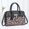 Chic black and cow print patchwork handbag with gold padlock and adjustable strap - Coffee with Black