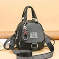 Black vintage leather shoulder bag with sequin S logo and red star charm decoration - Green