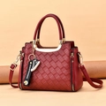 Burgundy woven embossed tote bag with chain strap and decorative daisy ribbon detail - Burgundy